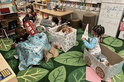 Students receiving gifts at Detroit Academy of Arts and Sciences