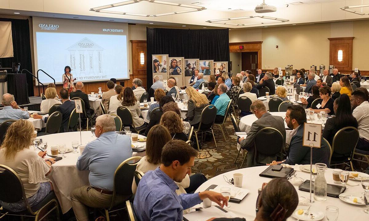 People in a banquet hall for a lecture